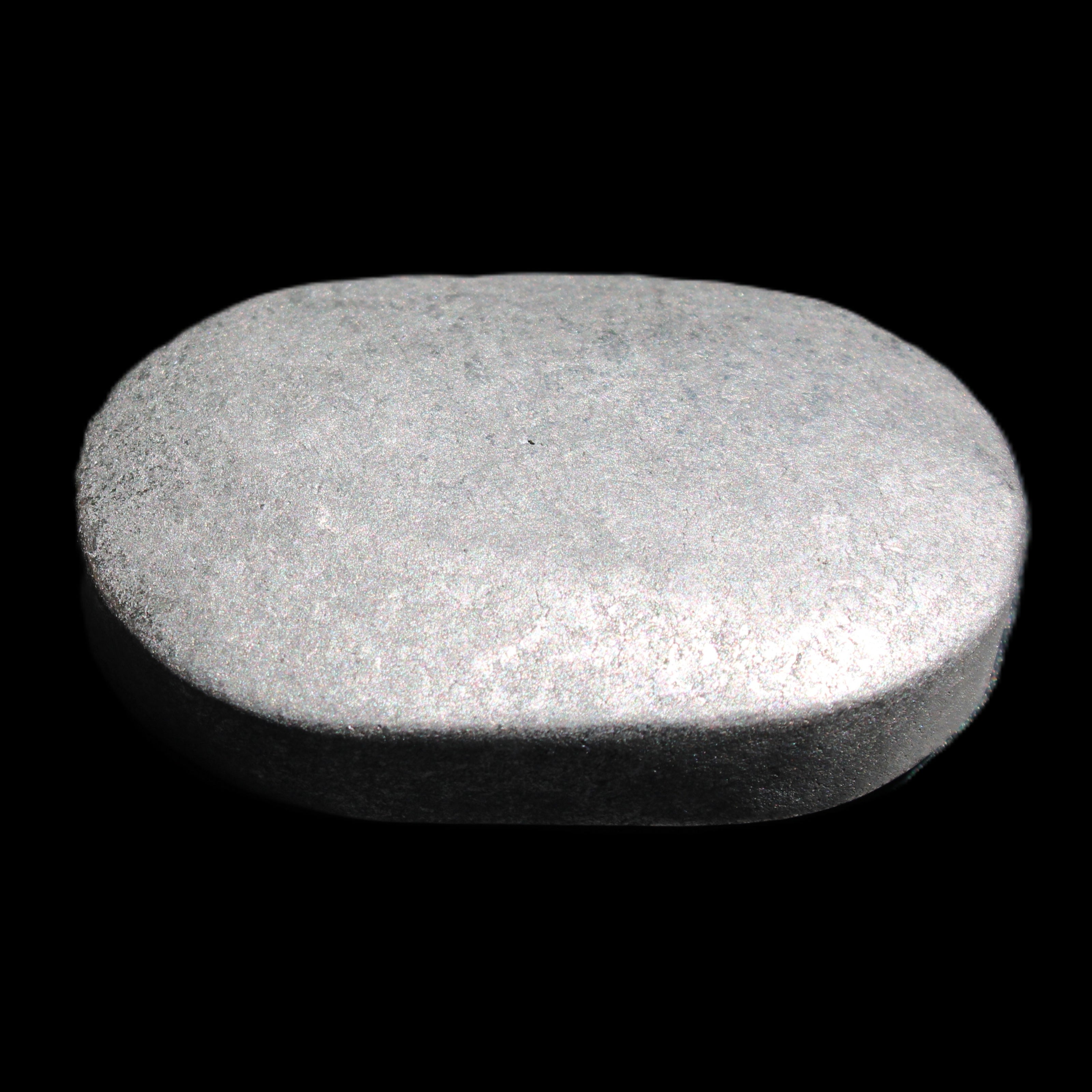 Shungite palmstone 63*40mm 56g in sunlight - Rocks and Things Store