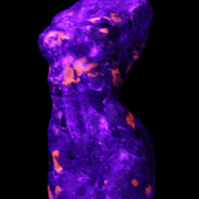 Yooperlite hand carved goddess 38*79mm 135g in UV light - Rocks and Things Store