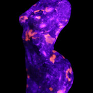 Yooperlite hand carved goddess 38*79mm 135g in UV light - Rocks and Things Store