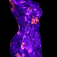 Yooperlite hand carved goddess 38*79mm 135g in UV light - Rocks and Things Store