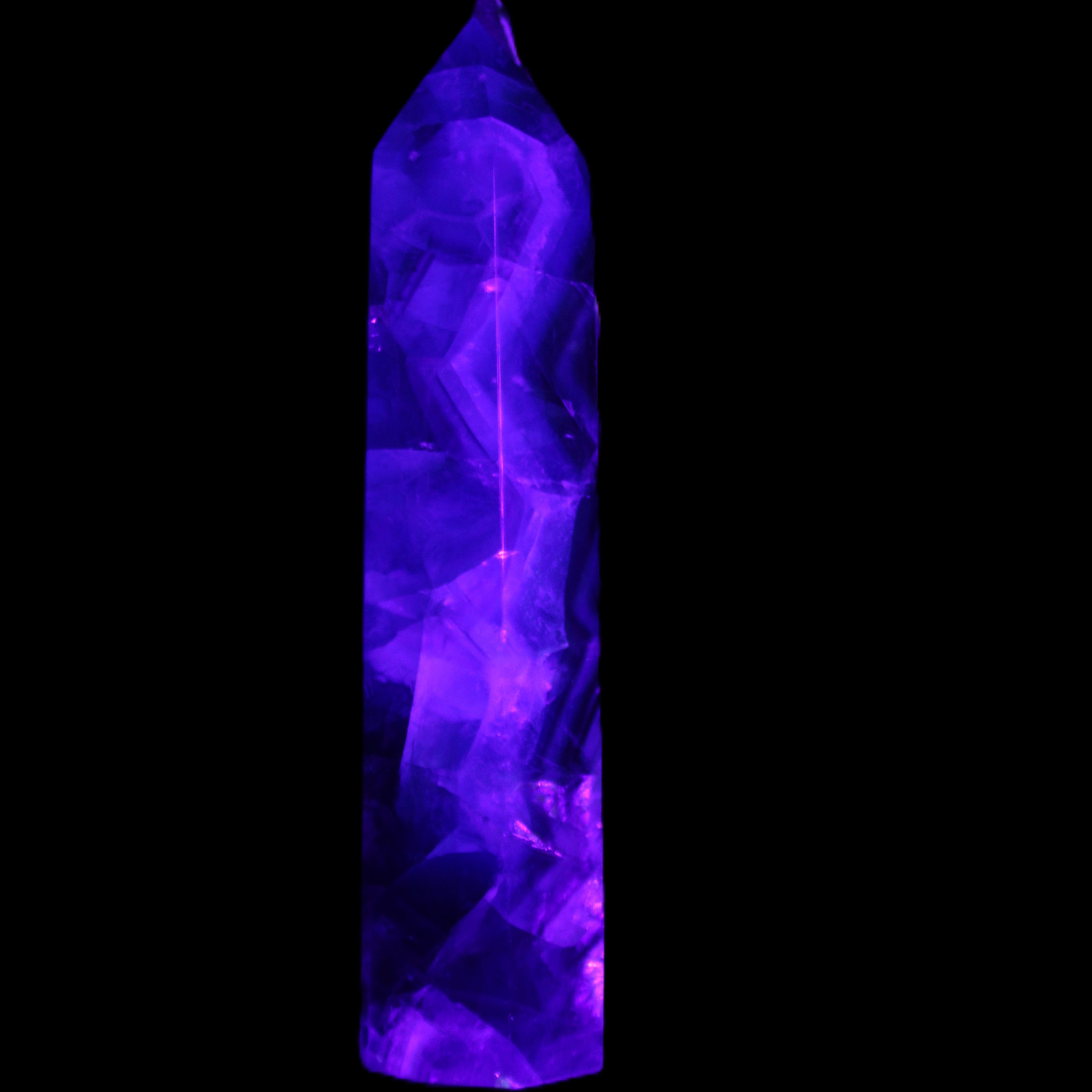 Rainbow Fluorite obelisk 116*26*30mm 151g in UV light - Rocks and Things Store