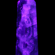Rainbow Fluorite obelisk 95*29*34mm 170g in UV light - Rocks and Things Store