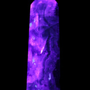 Rainbow Fluorite obelisk 95*29*34mm 170g in UV light - Rocks and Things Store