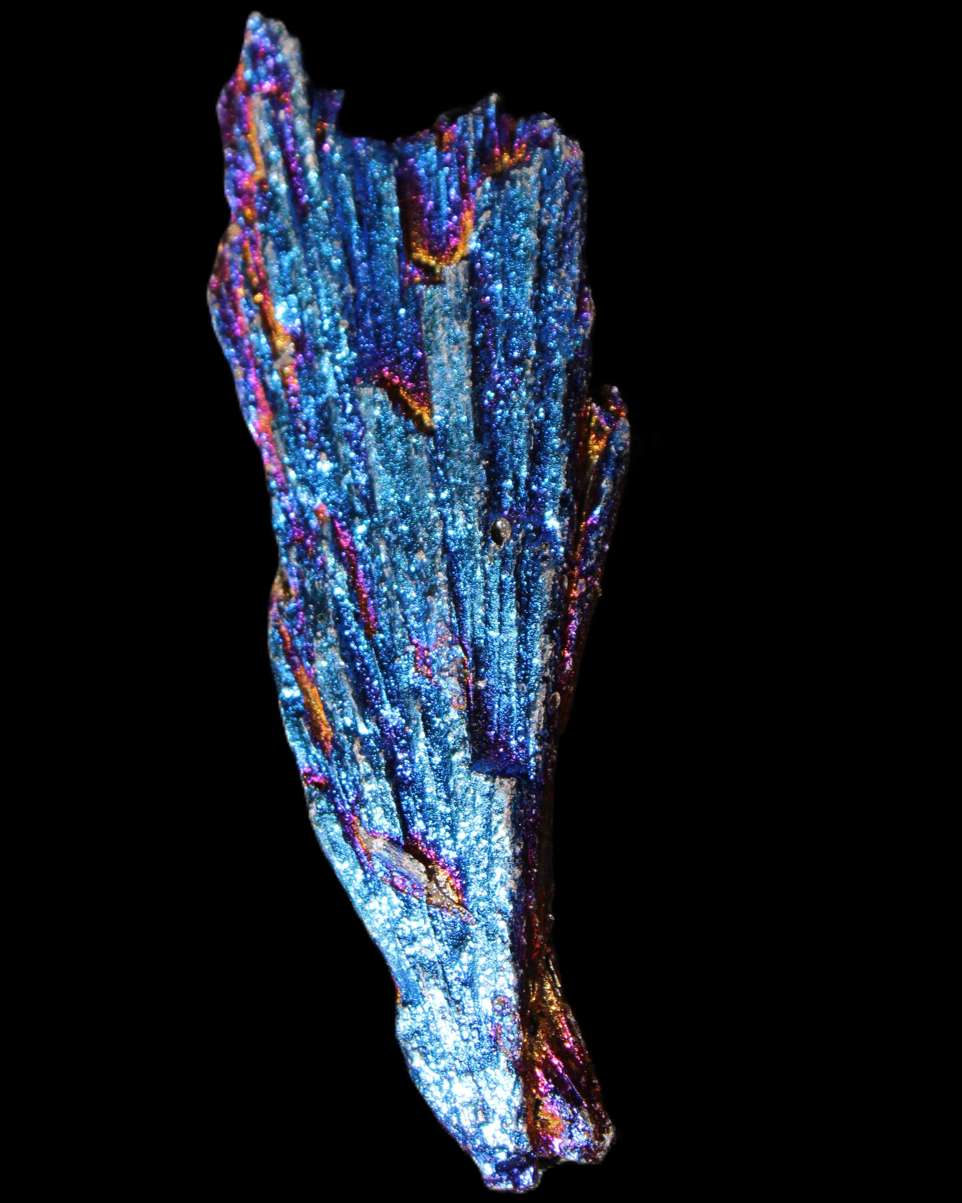 Titanium electroplated Tourmaline feather crystal 12-15g in sunlight - Rocks and Things Store