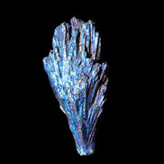 Titanium electroplated Tourmaline feather crystal 12-15g in sunlight - Rocks and Things Store