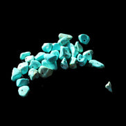 Turquoise 28 tiny drilled beads in bright sunlight - Rocks and Things Store