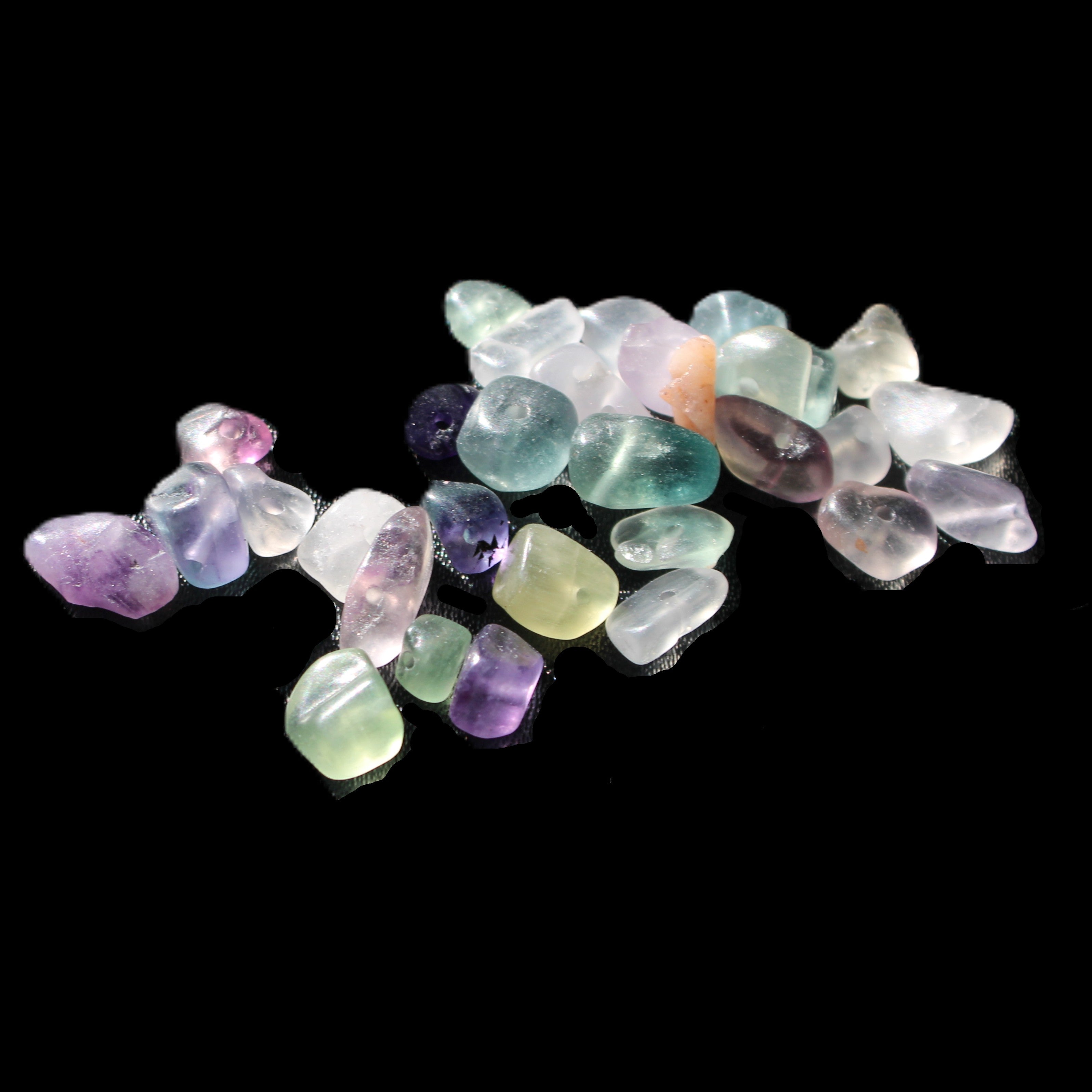 Fluorite 32 tiny drilled beads in bright sunlight - Rocks and Things Store