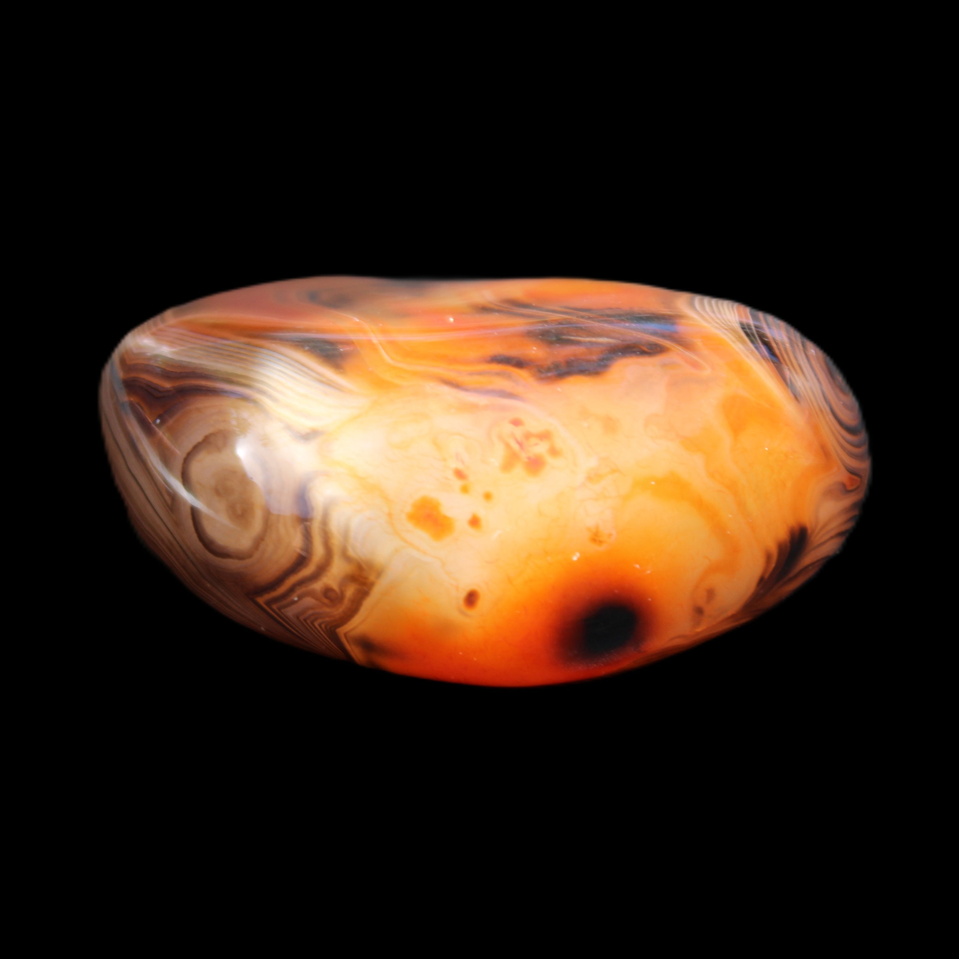 Crazy Lace Silk Banded Agate tumbled stone from Madagascar 39g in sunlight - Rocks and Things Store