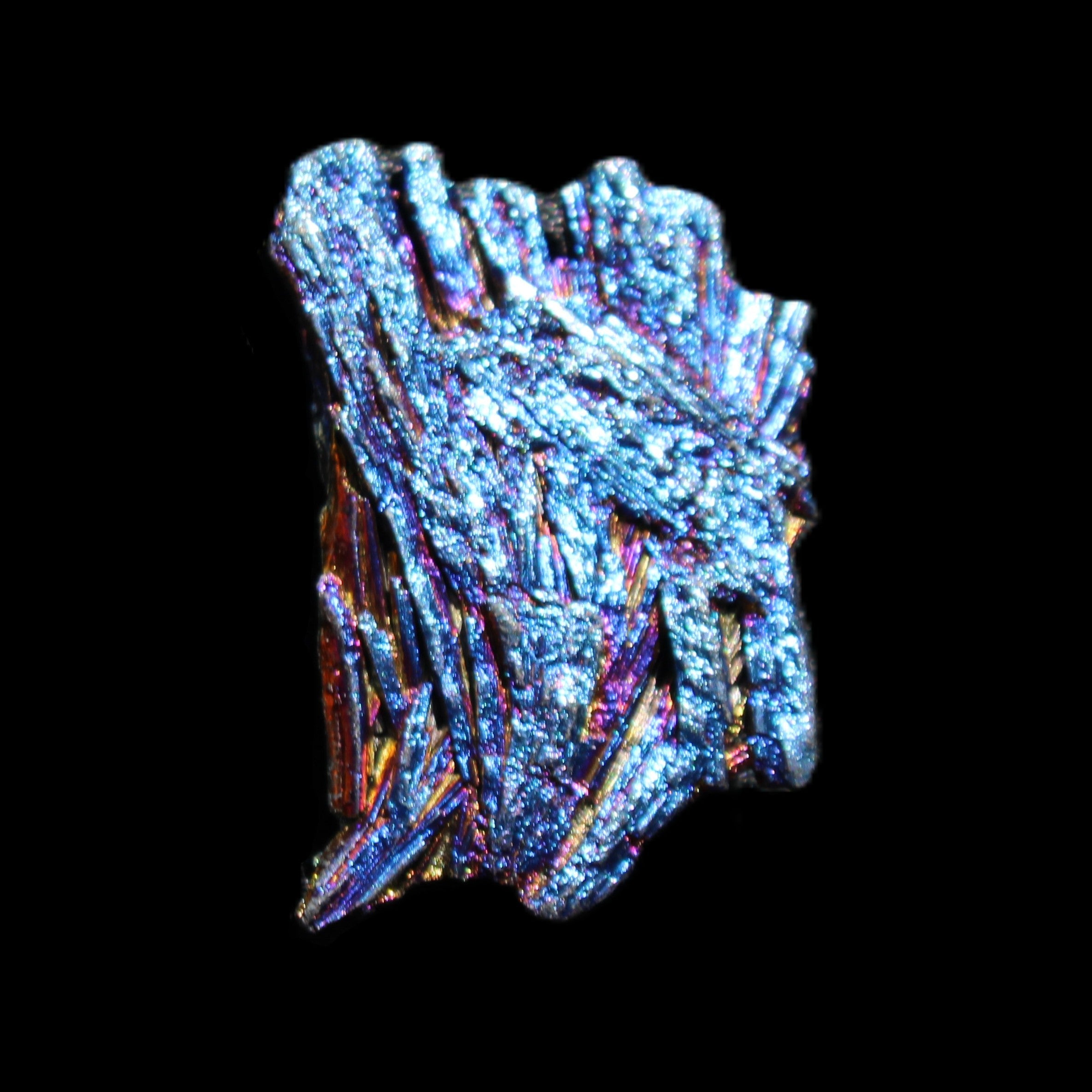 Titanium electroplated Tourmaline feather crystal 5.7g in sunlight - Rocks and Things Store