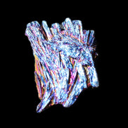 Titanium electroplated Tourmaline feather crystal 5.7g in sunlight - Rocks and Things Store