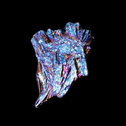 Titanium electroplated Tourmaline feather crystal 5.7g in sunlight - Rocks and Things Store