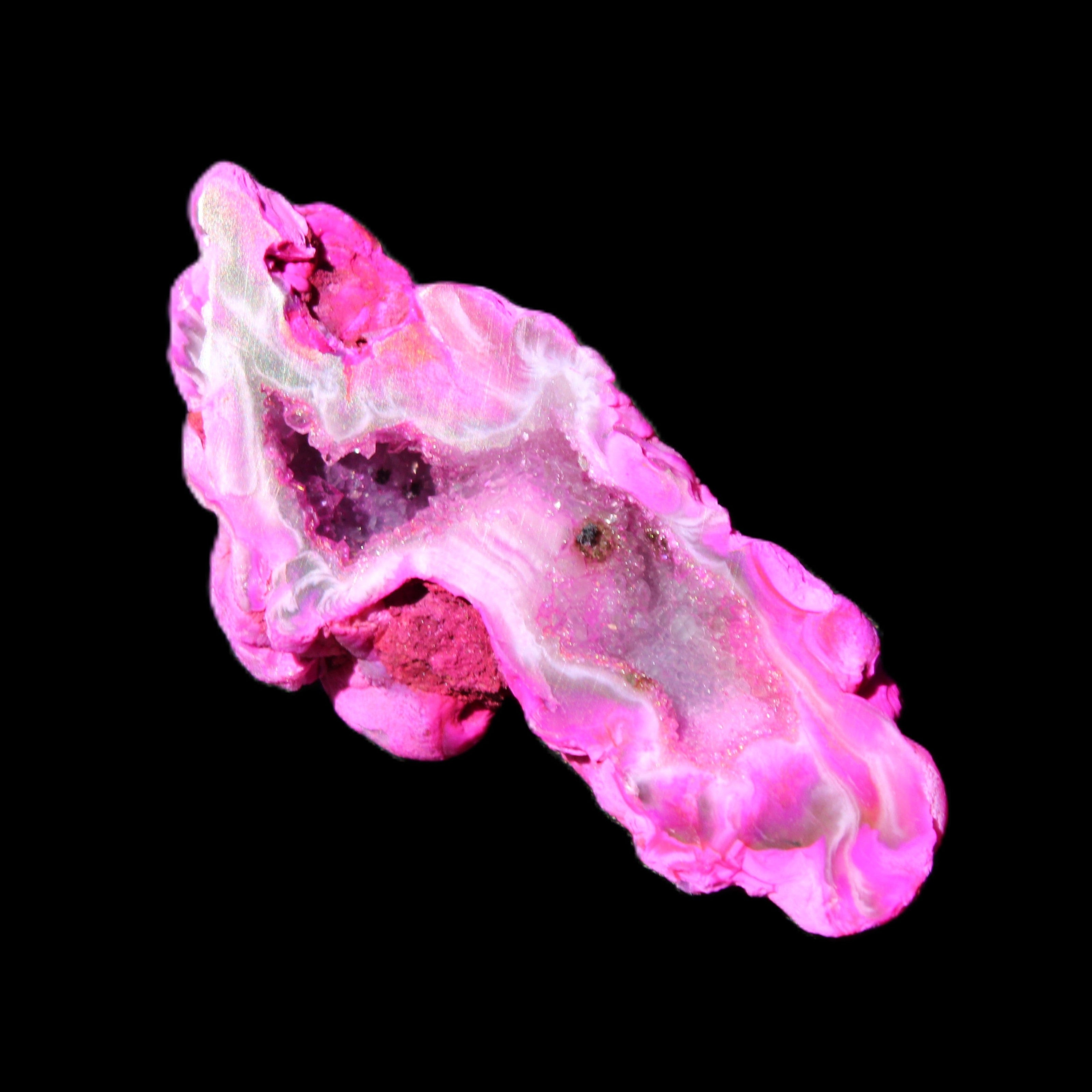 Magenta dyed Agate geode 52*24*16mm 15.5g in sunlight - Rocks and Things Store