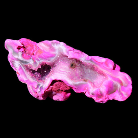 Magenta dyed Agate geode 52*24*16mm 15.5g in sunlight - Rocks and Things Store