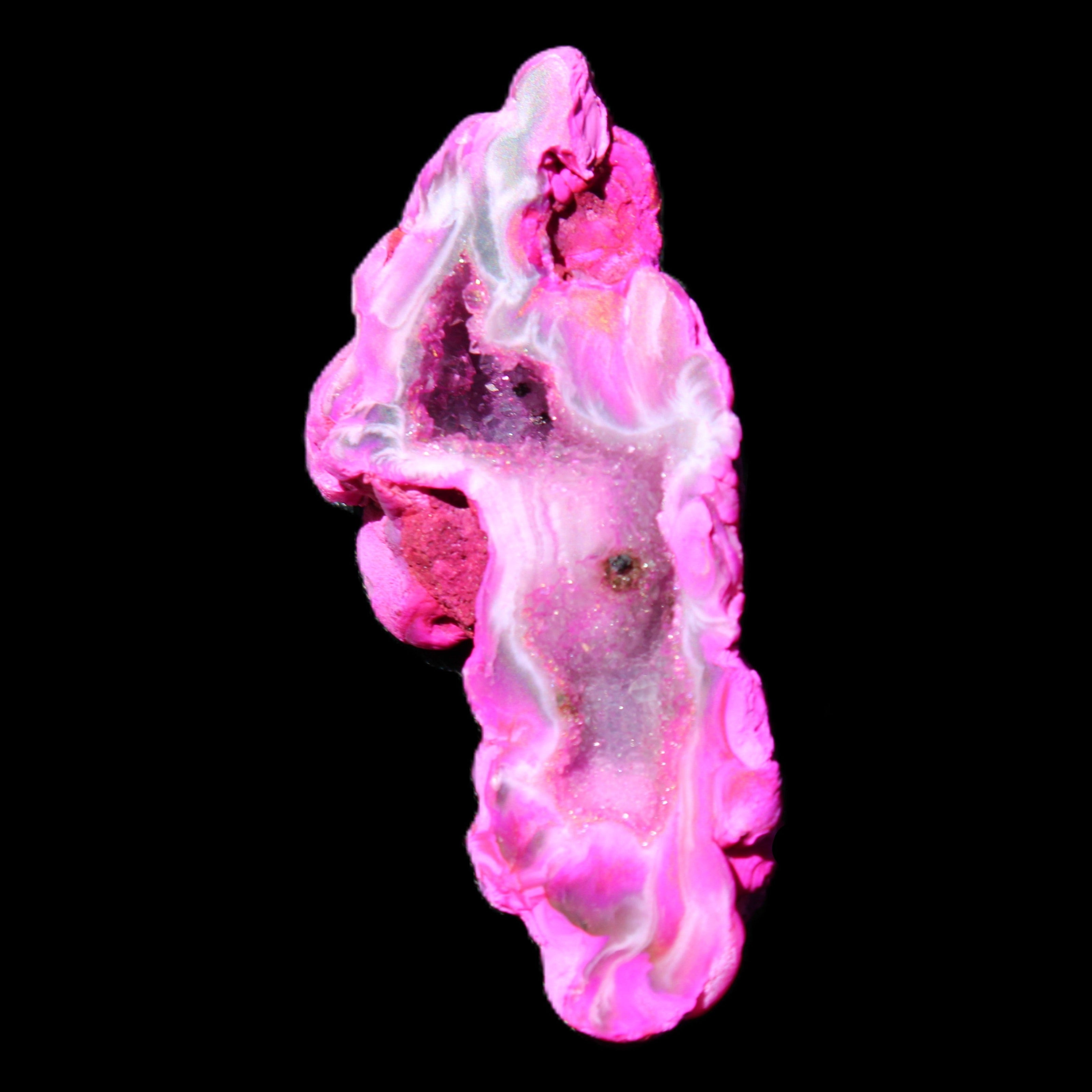 Magenta dyed Agate geode 52*24*16mm 15.5g in sunlight - Rocks and Things Store