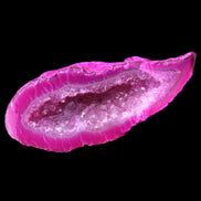 Magenta dyed Agate geode 54*22*11mm 16g in sunlight - Rocks and Things Store