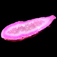 Magenta dyed Agate geode 54*22*11mm 16g in sunlight - Rocks and Things Store