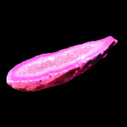 Magenta dyed Agate geode 54*22*11mm 16g in sunlight - Rocks and Things Store