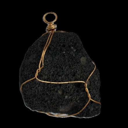 Vesicular Basalt wire-wrapped 28*27*33mm pendant 10.5g in sunlight - Rocks and Things Store