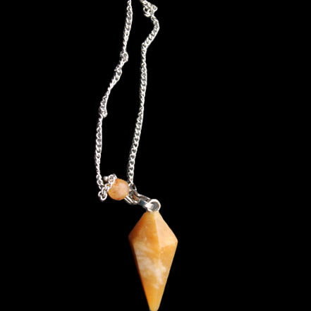 Yellow Aventurine pendulum 32mm 9g in sunlight - Rocks and Things Store