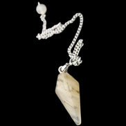 Rutile Quartz pendulum 32mm 8g in sunlight - Rocks and Things Store