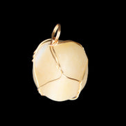 Yellow Calcite wire wrapped pendant 19*14*22mm 10g in sunlight - Rocks and Things Store