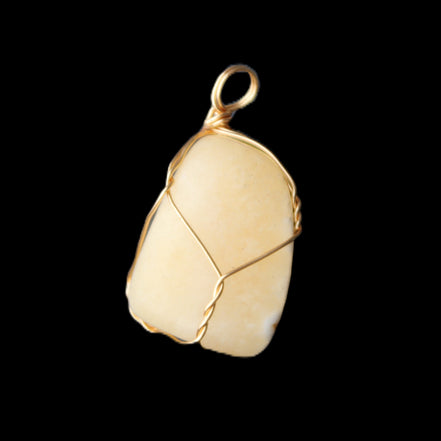 Yellow Calcite wire wrapped pendant 19*14*22mm 10g in sunlight - Rocks and Things Store