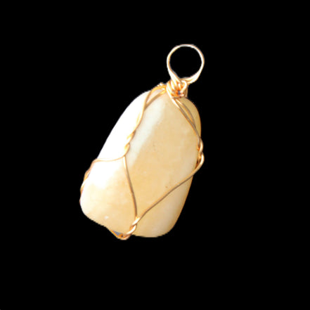 Yellow Calcite wire wrapped pendant 19*14*22mm 10g in sunlight - Rocks and Things Store