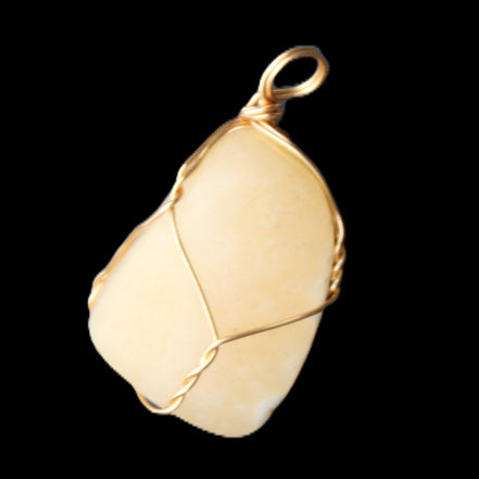Yellow Calcite wire wrapped pendant 19*14*22mm 10g in sunlight - Rocks and Things Store