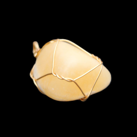 Yellow Calcite wire wrapped pendant 19*14*22mm 10g in sunlight - Rocks and Things Store