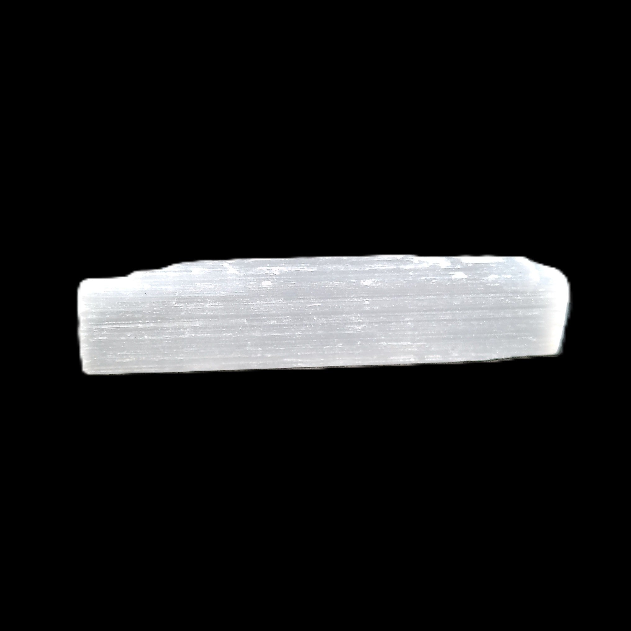 Selenite rod 55mm 7/9g in sunlight - Rocks and Things Store