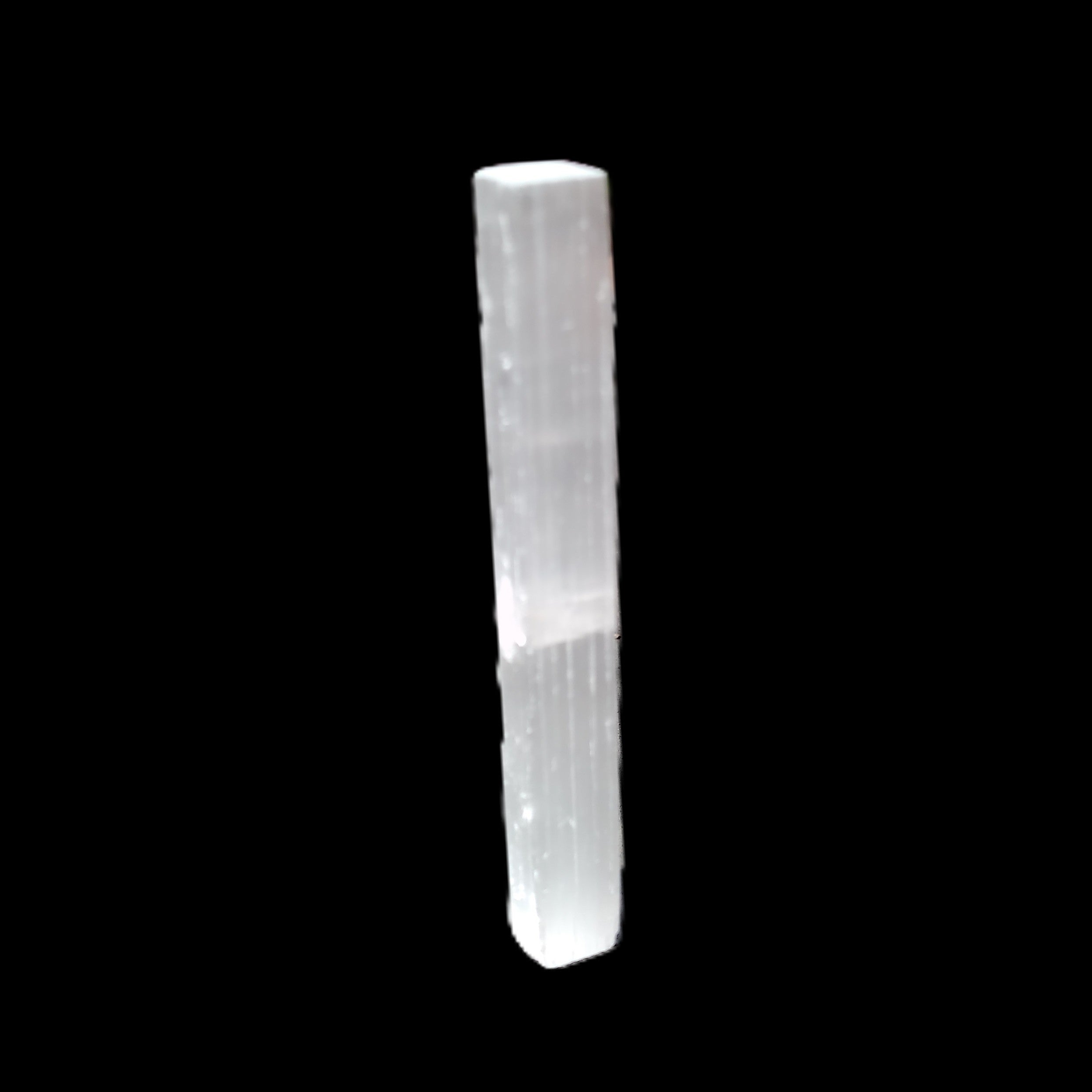 Selenite rod 83*9*9mm 17g in sunlight - Rocks and Things Store
