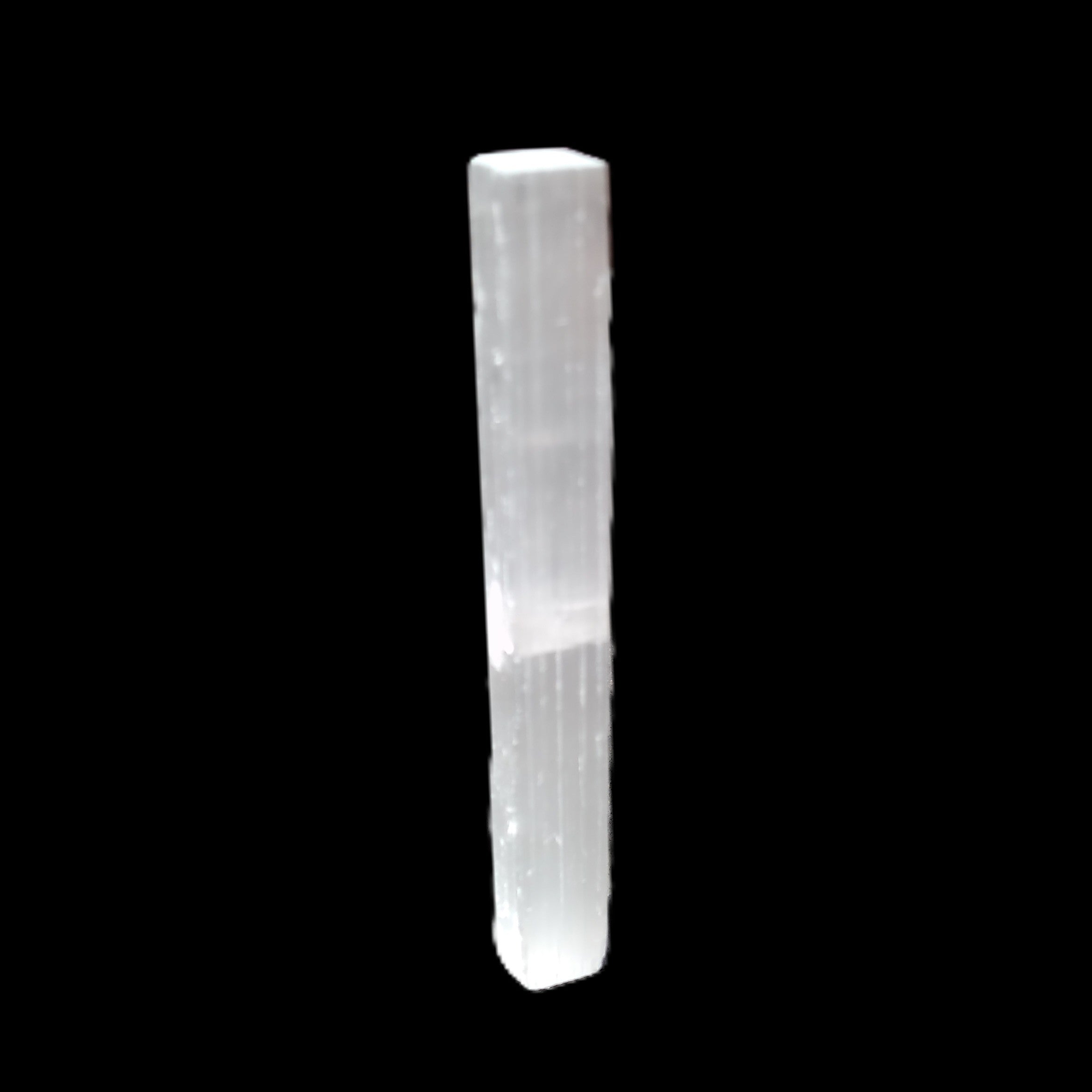 Selenite rod 83*9*9mm 17g in sunlight - Rocks and Things Store
