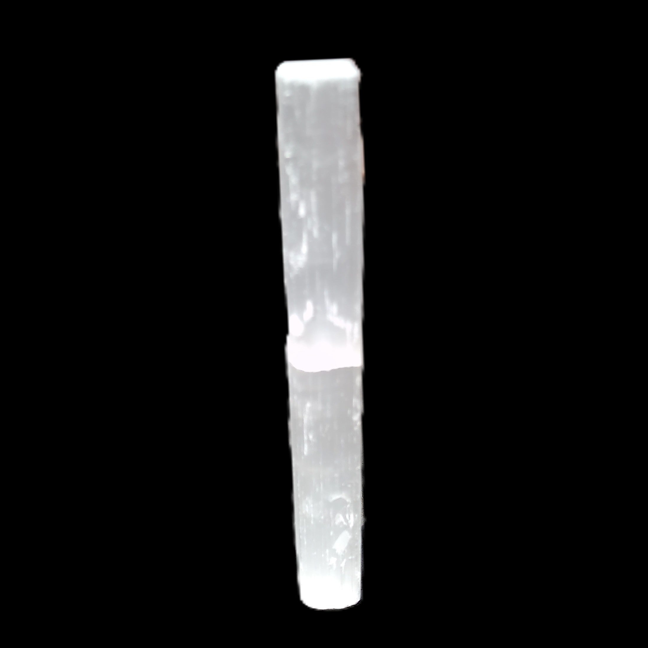 Selenite rod 83*9*9mm 17g in sunlight - Rocks and Things Store