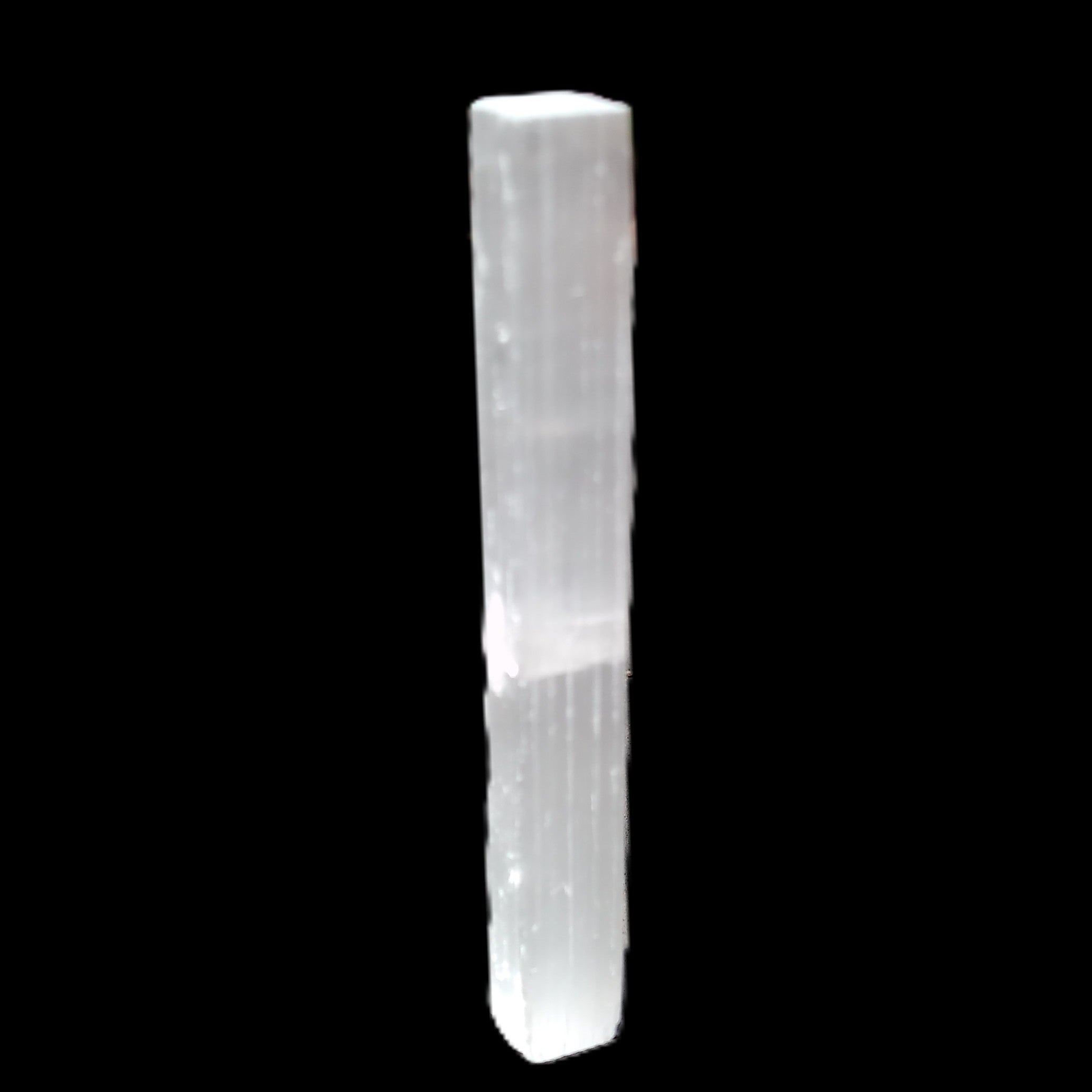 Selenite rod 83*9*9mm 17g in sunlight - Rocks and Things Store
