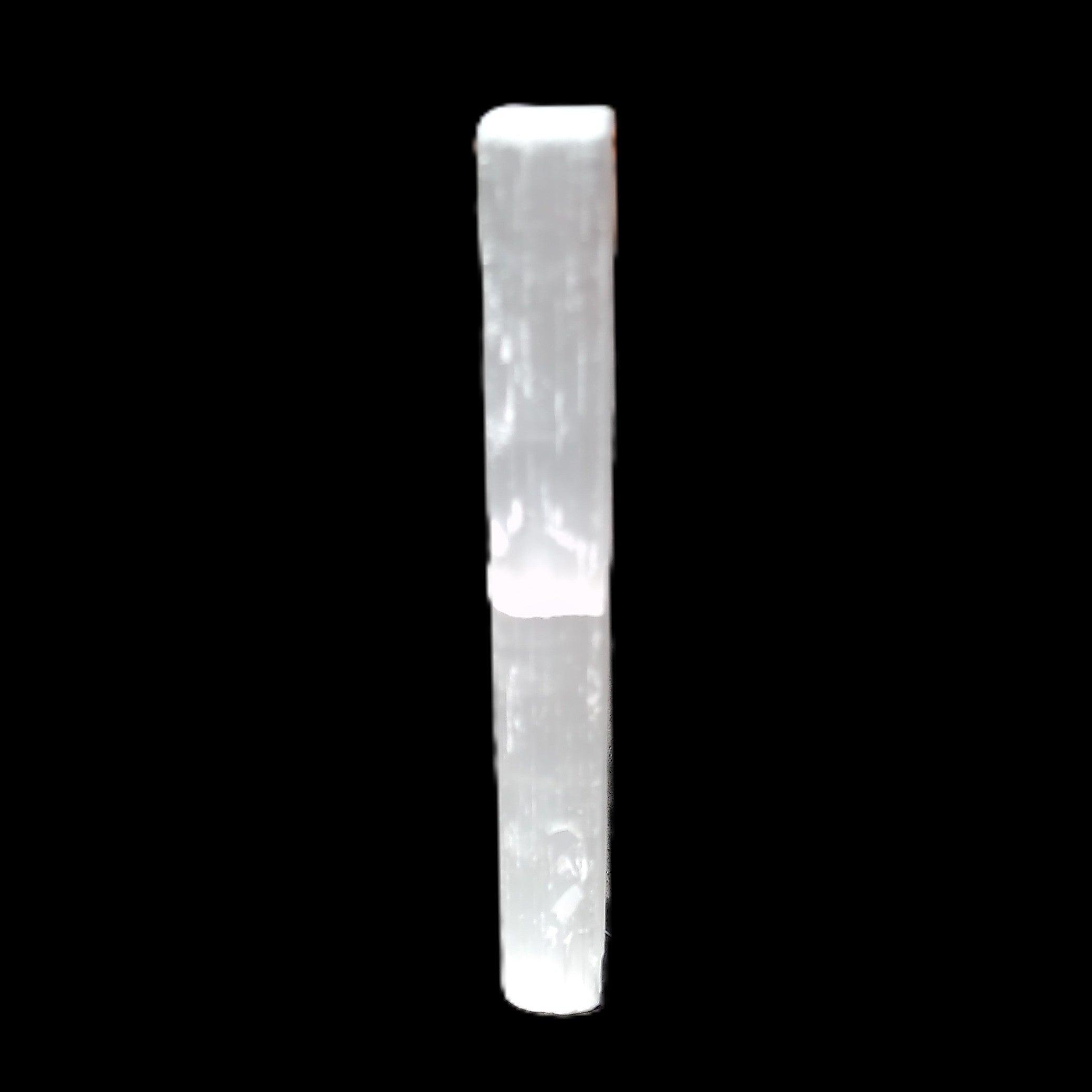 Selenite rod 83*9*9mm 17g in sunlight - Rocks and Things Store