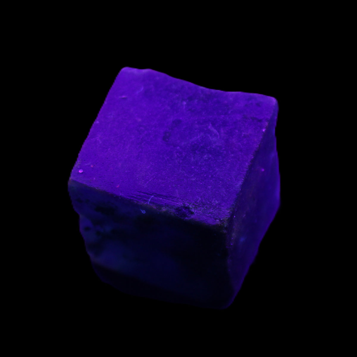 Sapphire cube from Sri Lanka (dyed) 24mm 141ct in UV light - Rocks and Things Store