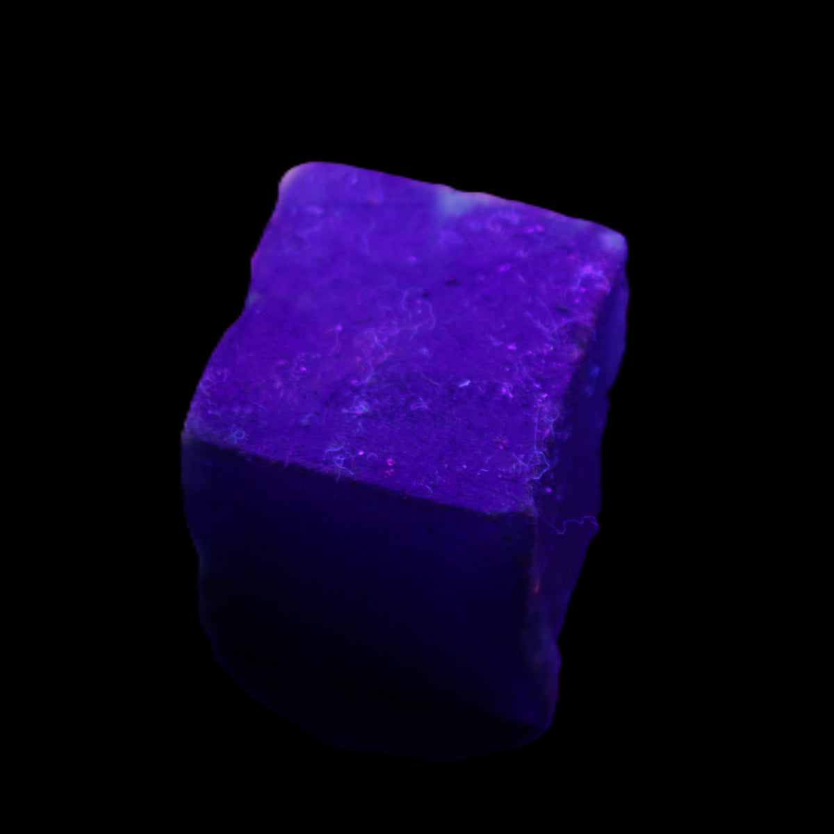 Sapphire cube from Sri Lanka (dyed) 24mm 141ct in UV light - Rocks and Things Store