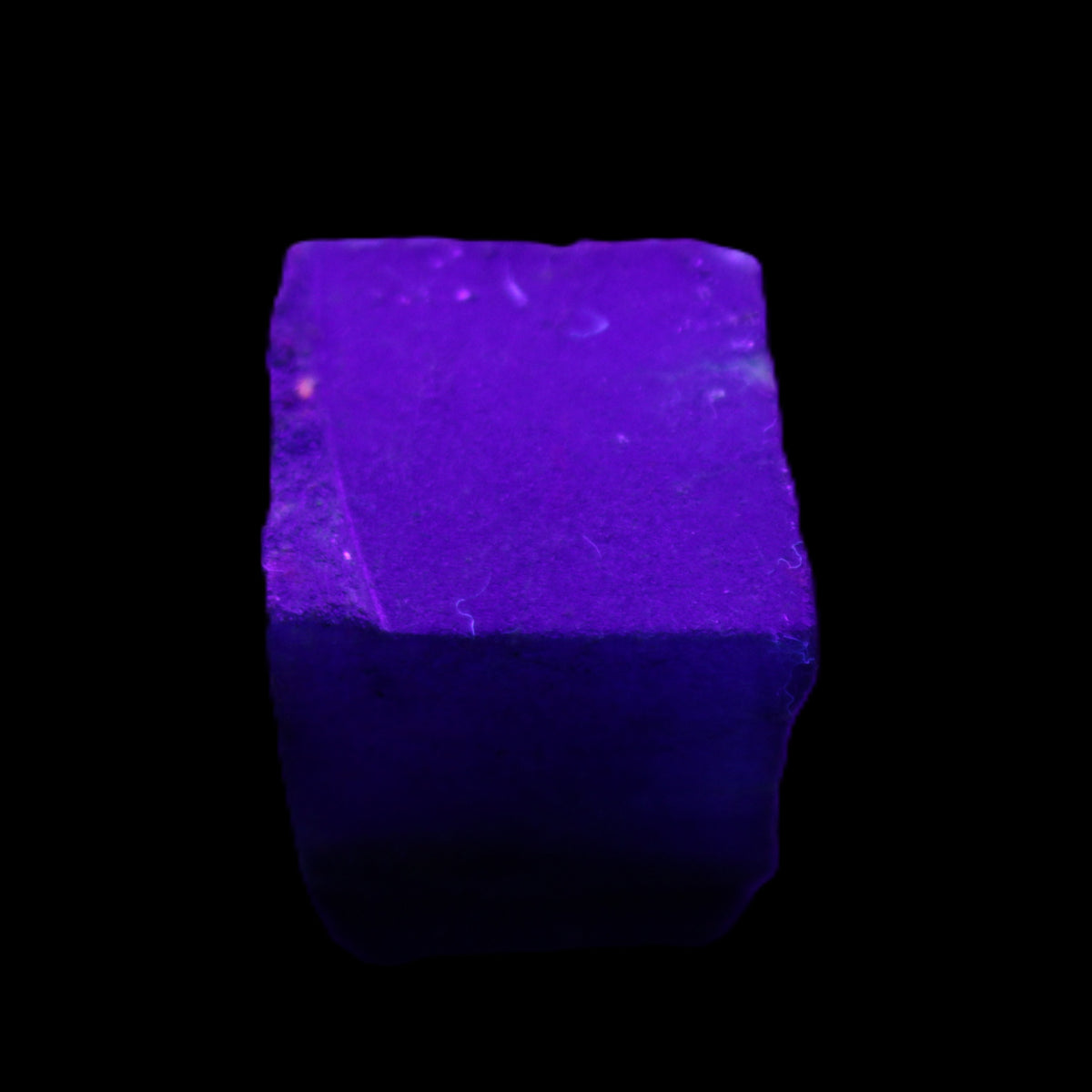 Sapphire cube from Sri Lanka (dyed) 24mm 141ct in UV light - Rocks and Things Store