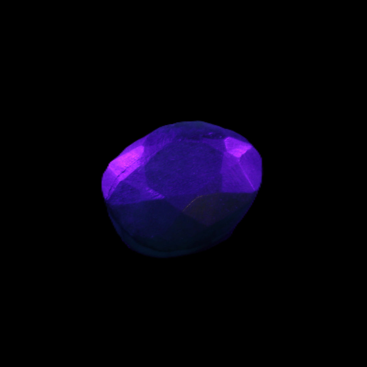 Green Emerald Oval cut from Columbia 7m 11ct 2g in UV light - Rocks and Things Store