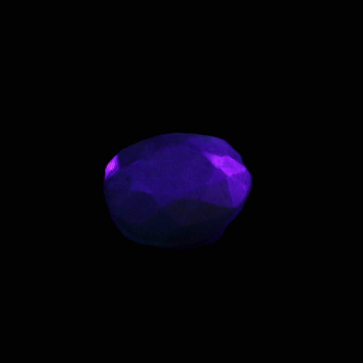 Green Emerald Oval cut from Columbia 7m 11ct 2g in UV light - Rocks and Things Store
