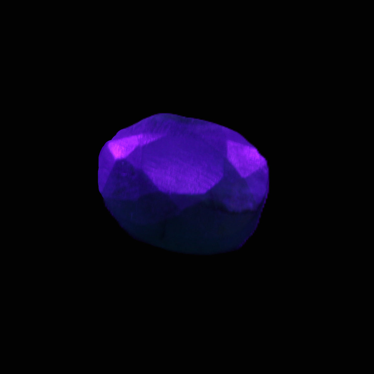 Green Emerald Oval cut from Columbia 7m 11ct 2g in UV light - Rocks and Things Store