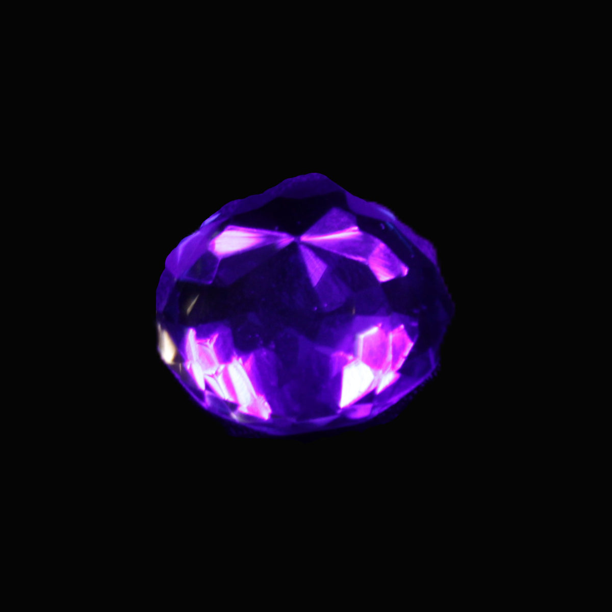 Blue Tanzanite round cut gemstone 11*8mm 7.95ct 1.8g in UV light - Rocks and Things Store