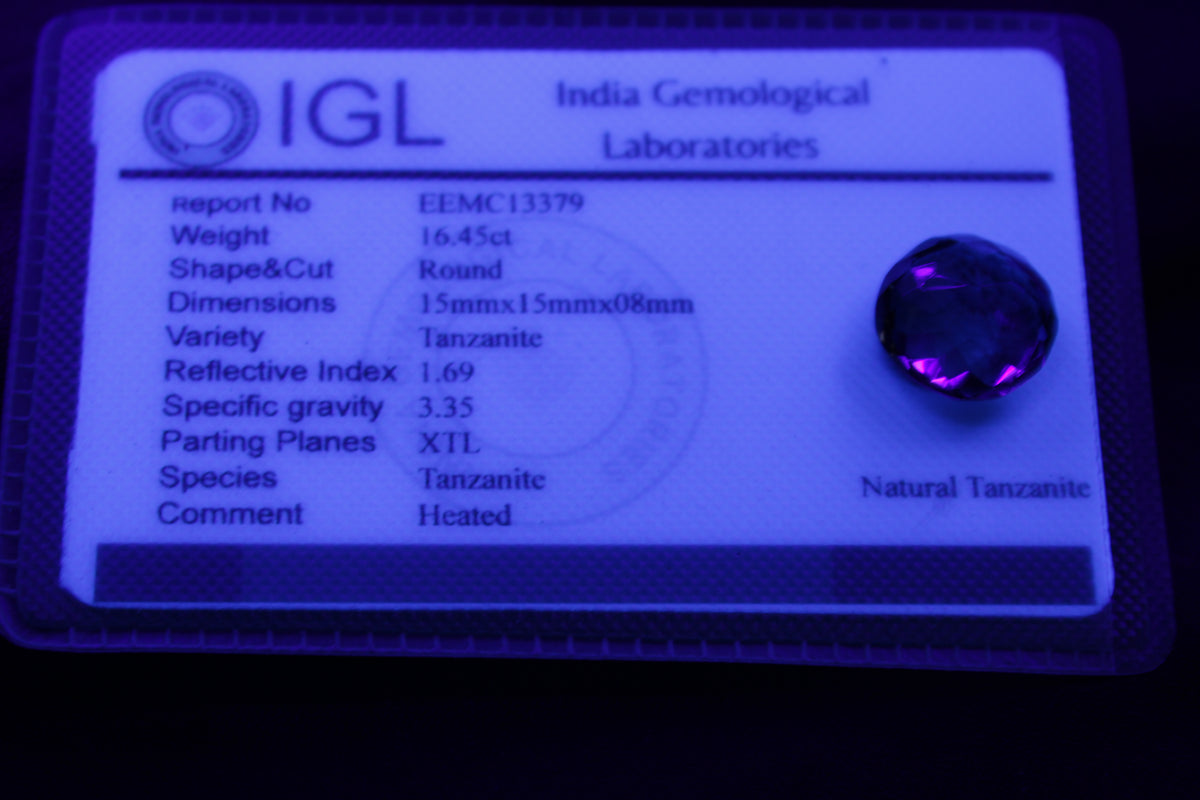 Blue Tanzanite round cut gemstone 11*8mm 7.95ct 1.8g in UV light - Rocks and Things Store