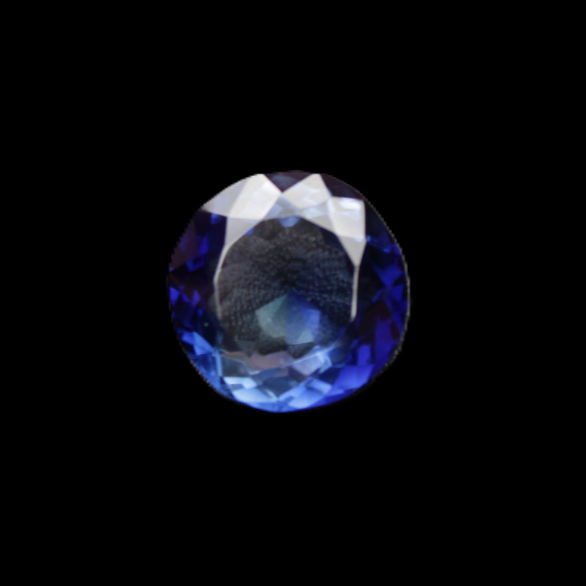 Blue Tanzanite round cut gemstone 11*8mm 7.95ct 1.8g in sunlight - Rocks and Things Store