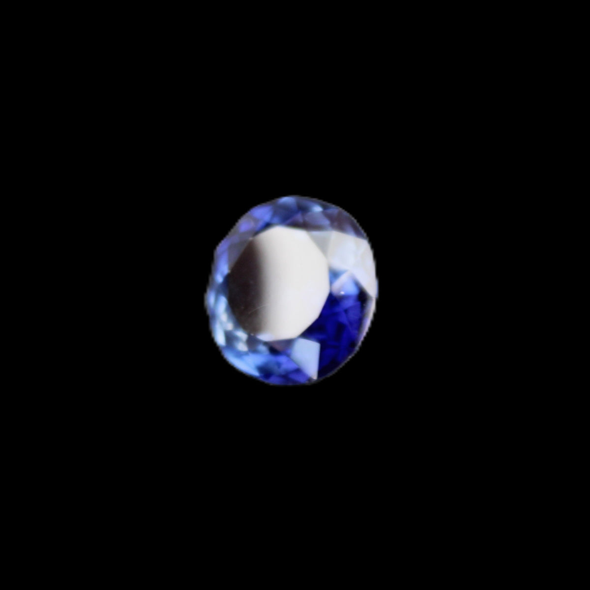 Blue Tanzanite round cut gemstone 11*8mm 7.95ct 1.8g in sunlight - Rocks and Things Store