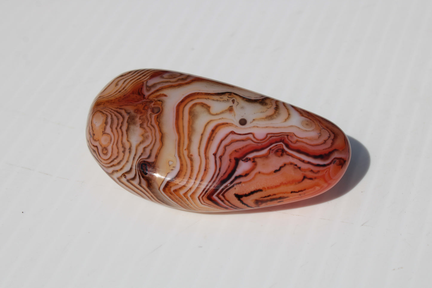 Crazy Lace Silk Banded Agate tumbled stone from Madagascar 59.1g Rocks and Things