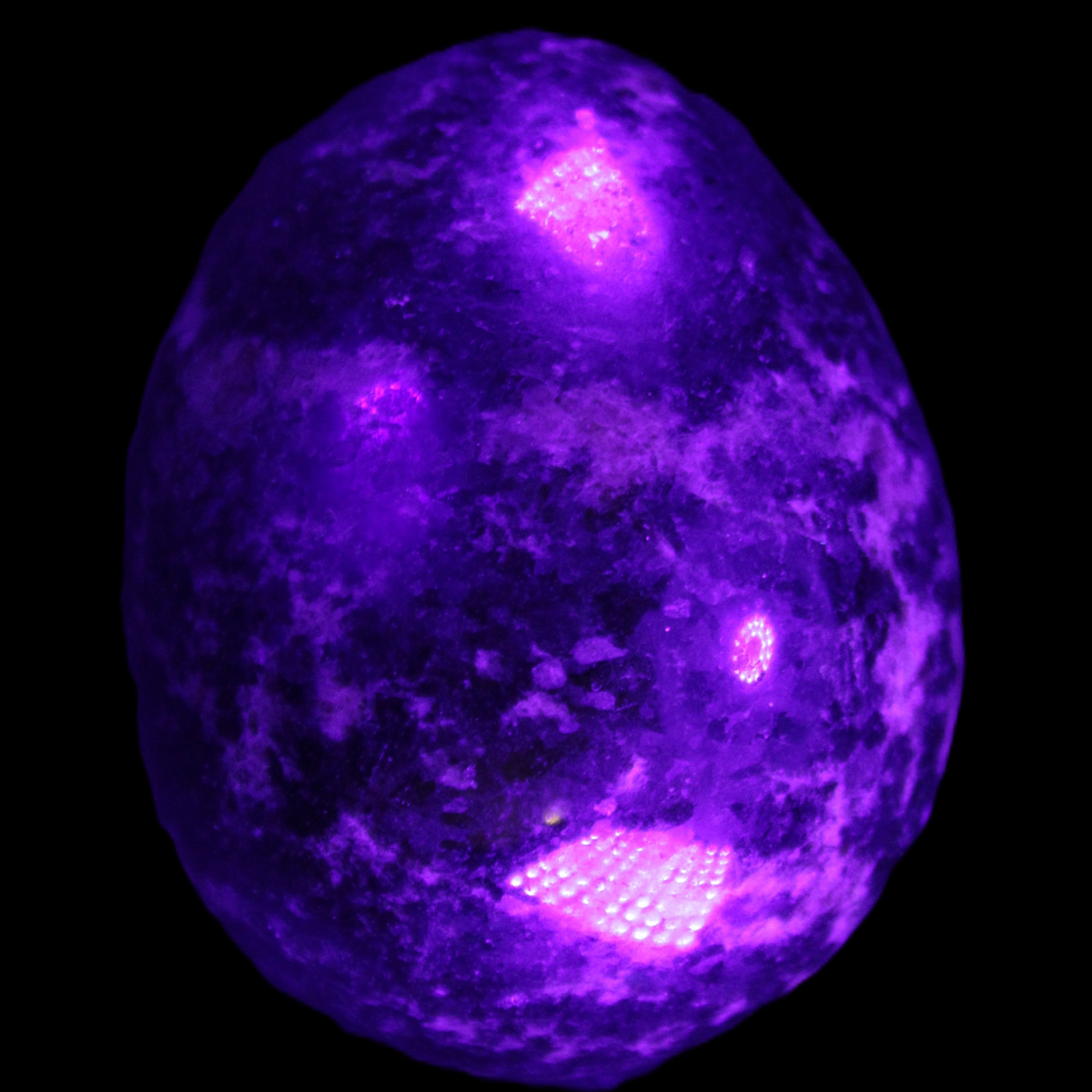 Rhodonite egg 248g in UV light - Rocks and Things Store
