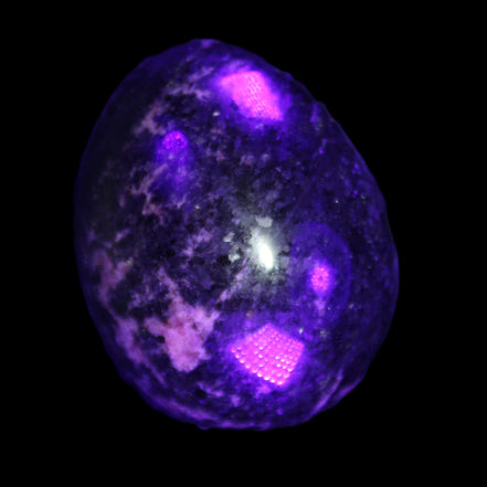 Rhodonite egg 248g in UV light - Rocks and Things Store