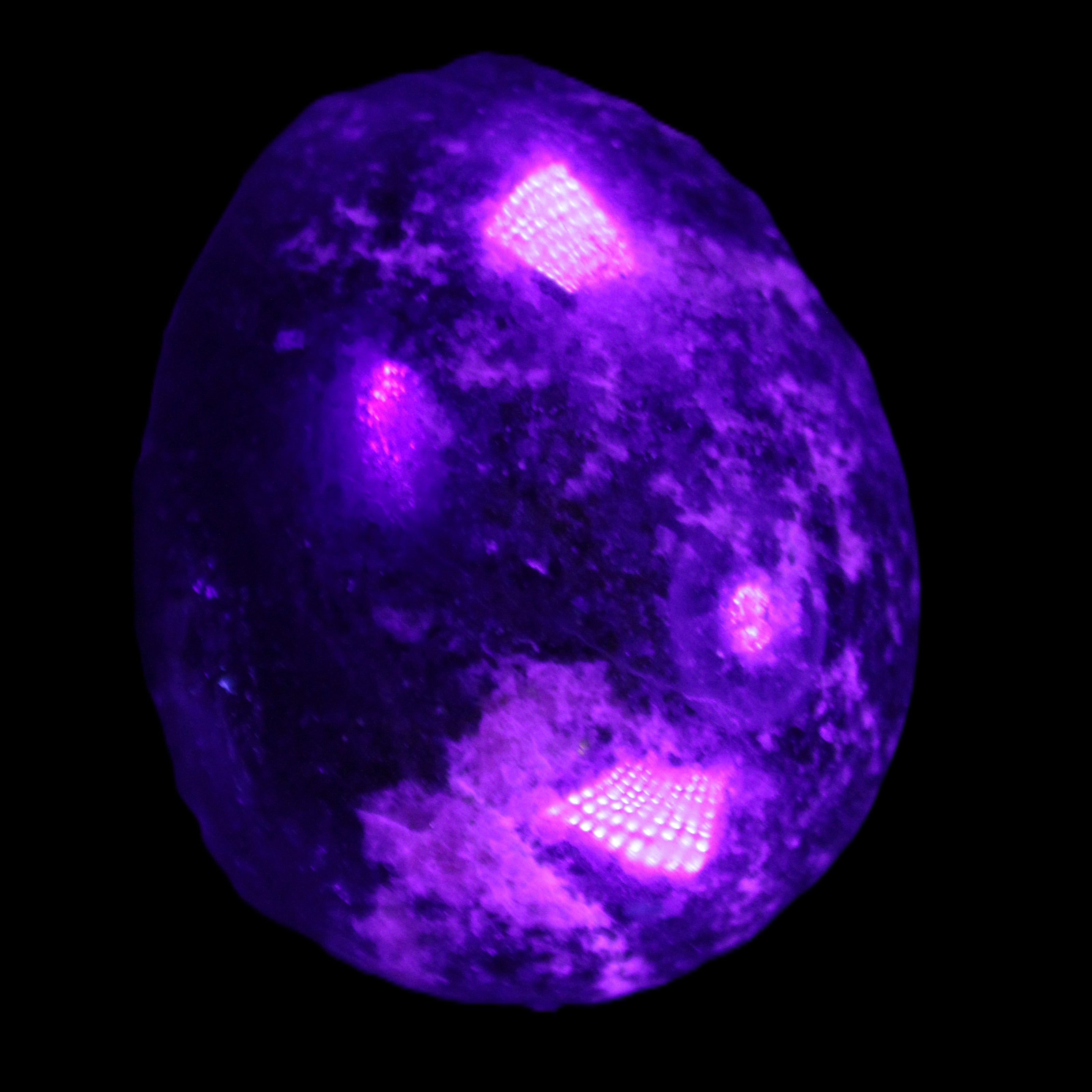 Rhodonite egg 248g in UV light - Rocks and Things Store