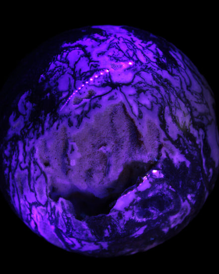 Ocean Moss Agate with geode cave sphere 4500g in UV light